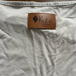 Kyte Baby car seat cover in oat